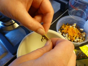 Extracting cardamom seeds from the pods