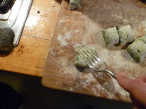 Marking grooves in the gnocchi to hold a sauce