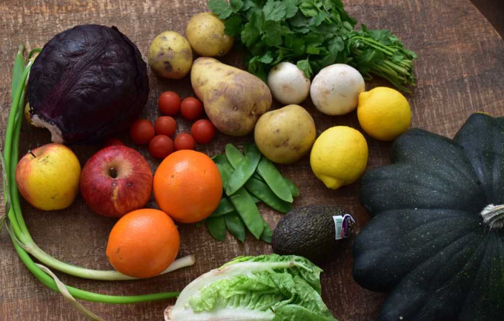 A tsble full of assorted fruits and vegetables
