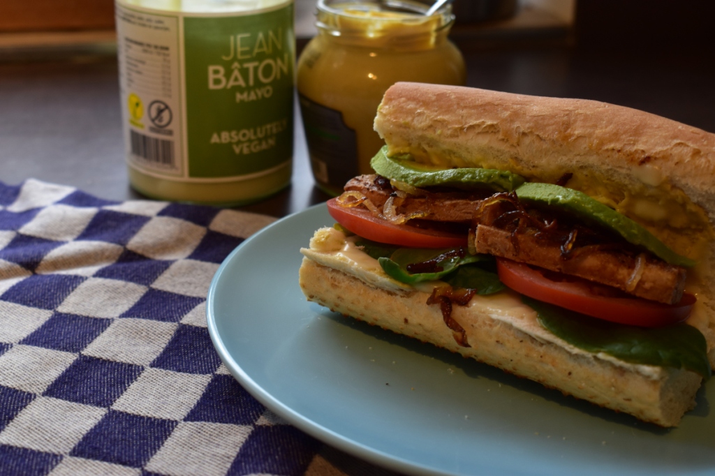 A vegan Tofu, lettuce & tomato sandwich. All the better for an addition of avocado and caramelised onions